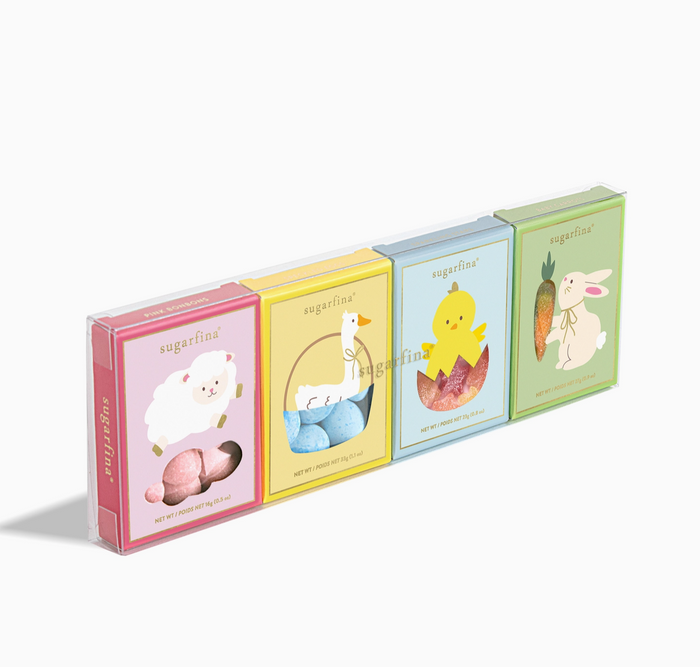 Set of four small books with colorful covers featuring animal illustrations on a white background.