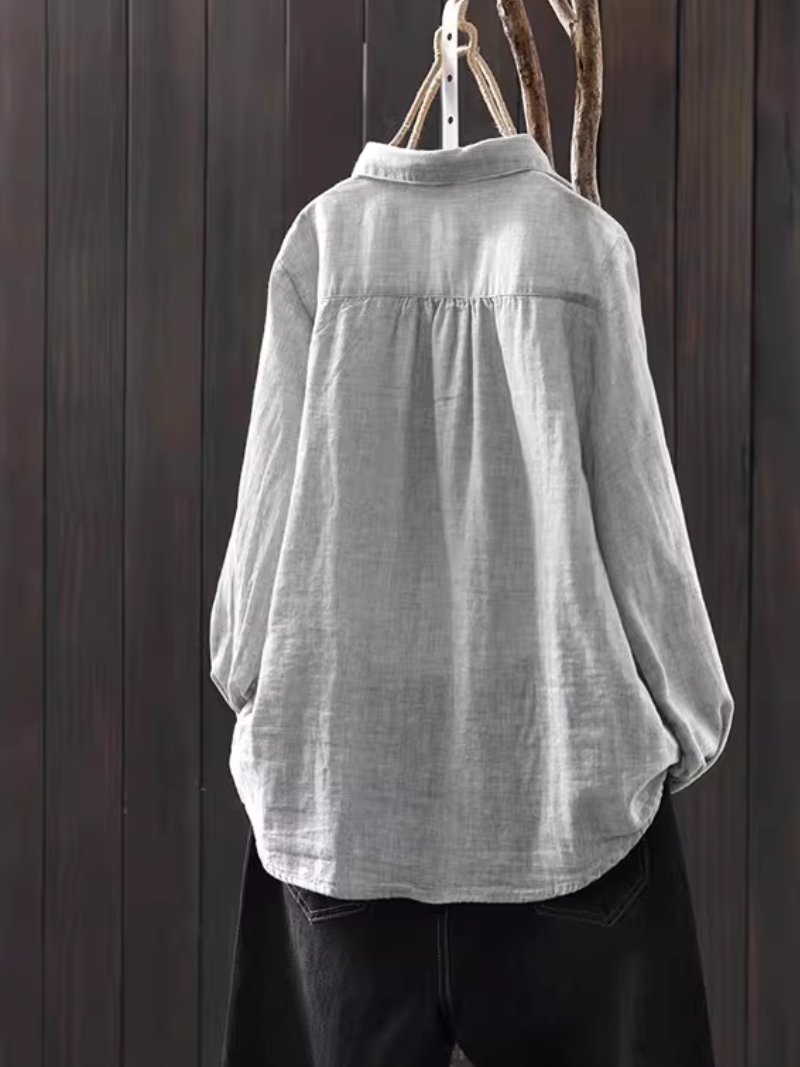 Minimalist cotton-linen button-down blouse with relaxed silhouette for elevated everyday style