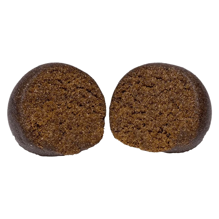 Close-up front view of two brown halves of an Animal Face Temple Ball set against a plain background.