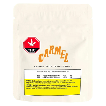 Front-facing pouch shot of a white Carmel Animal Face Temple Ball bag with a red THC badge and yellow warning panel.