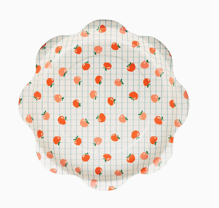 Decorative plate with peach pattern on a white background