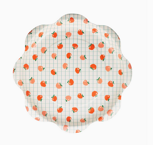 Decorative plate with peach pattern on a white background