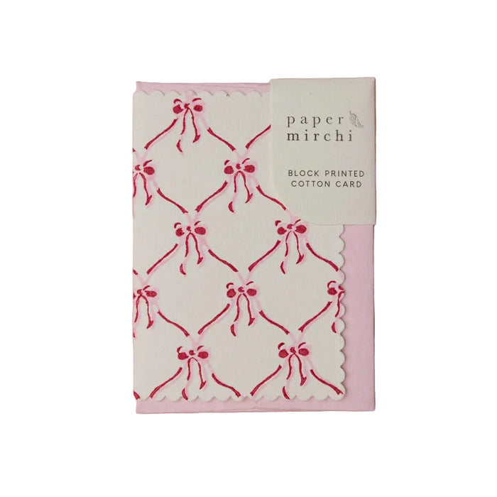 Block printed cotton greeting card with red bow pattern on a white background, branded 'Paper Mirchi'.