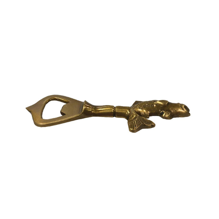 Gold bottle opener with a fish design on a white background