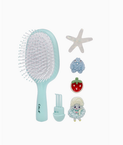 Set of hairbrush, starfish, bath ball, and bath toy on a white background