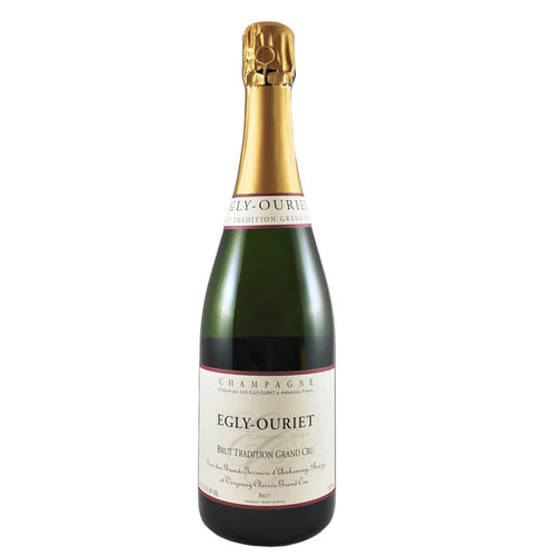 Champagne bottle with gold foil top and Egly-Ouriet Brut Tradition label