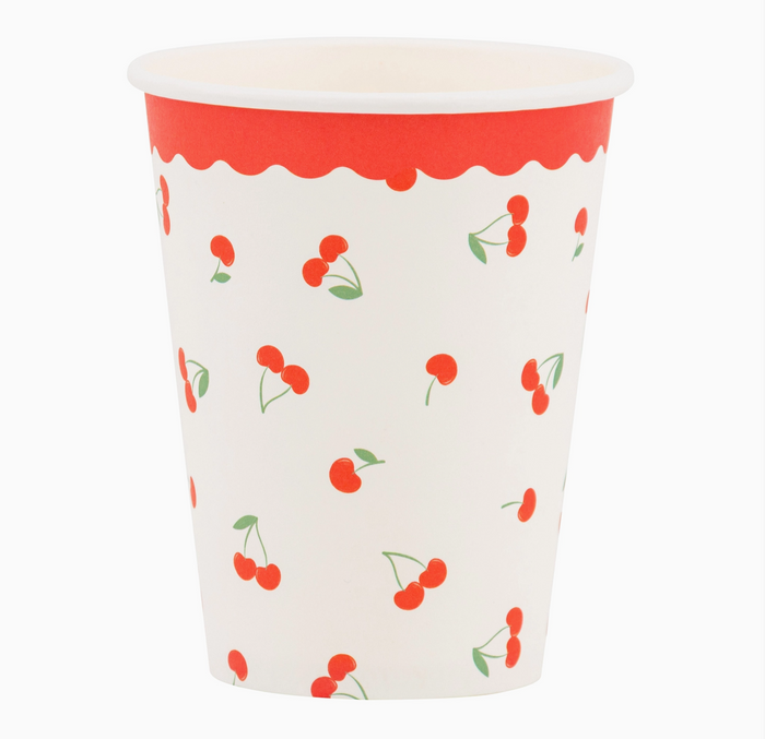 Paper cup with red cherry pattern on a white background