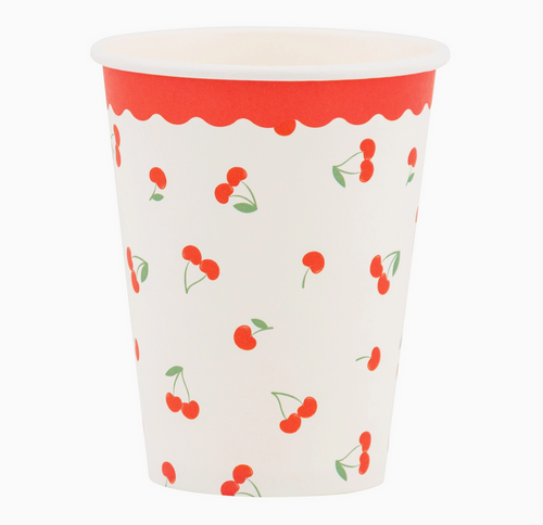 Paper cup with red cherry pattern on a white background