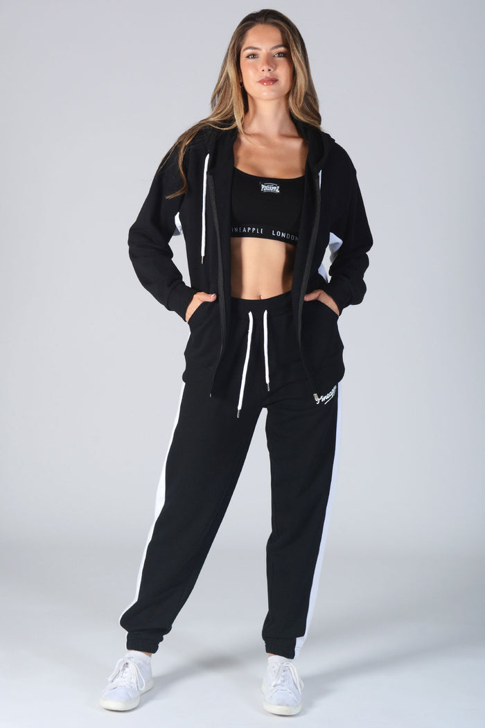 Woman wearing black Contrast Panel Joggers and matching jacket