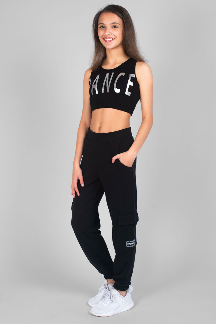 Girl wearing black Crop Dance print Vest and black Cargo Joggers