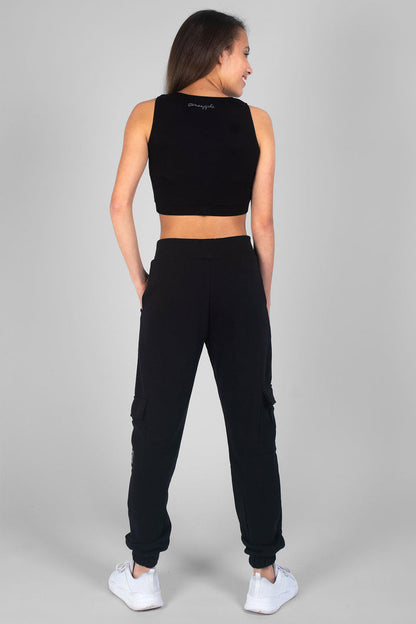 Girl wearing sleeveless black Crop Dance Vest and black Cargo Joggers