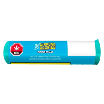 Horizontal studio shot of a bright blue tube labeled Diamond Doobies - Code Blue Infused PR 2 x 0.5 g with a red THC octagon and white blank address panel.
