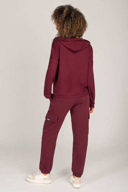 Burgundy women's loungewear hoodie with dipped hem