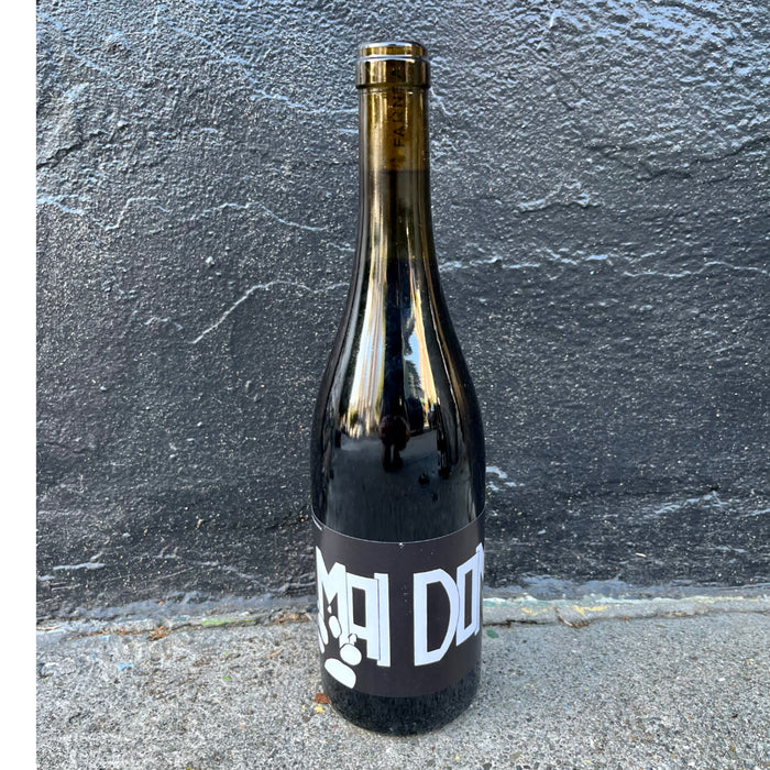Glass wine bottle with gold foil neck and dark label