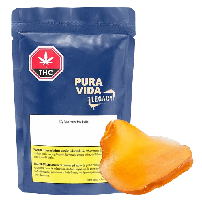 Front-facing shot of a blue resealable pouch and an amber slab labeled Fatso Jumbo Slab Shatter by Pura Vida Legacy.