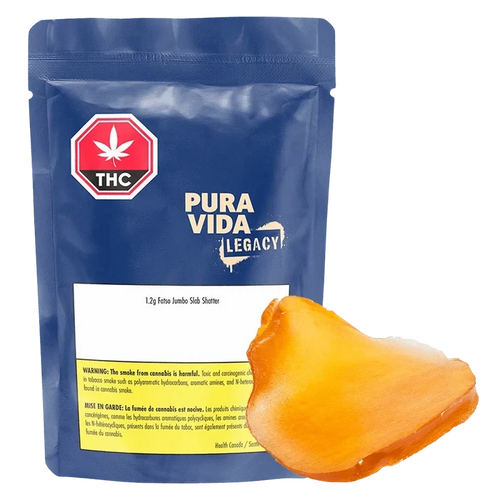 Front-facing shot of a blue resealable pouch and an amber slab labeled Fatso Jumbo Slab Shatter by Pura Vida Legacy.