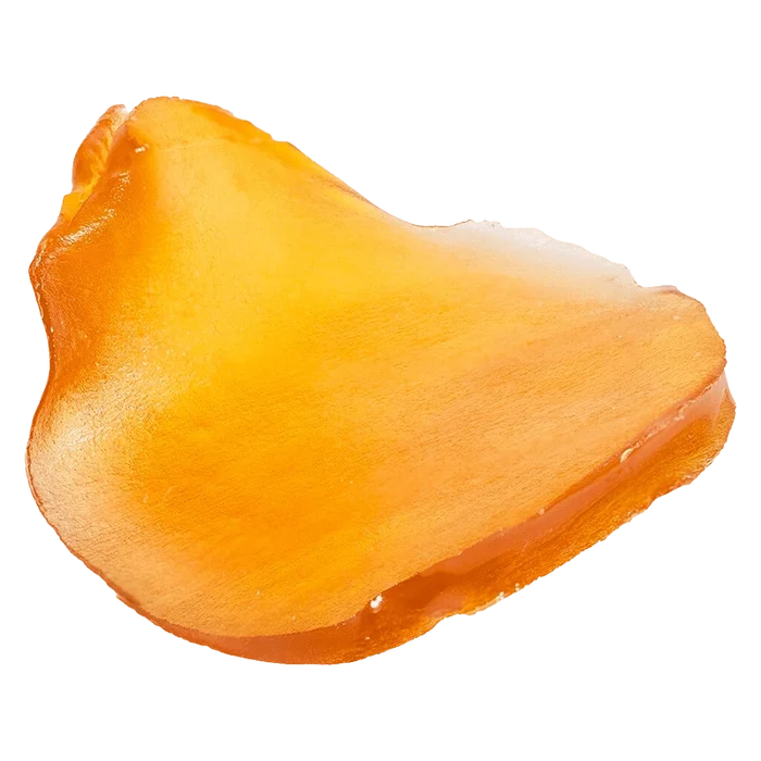 Close-up top-side view of a glossy amber slab of Fatso Jumbo Slab Shatter against a plain white background
