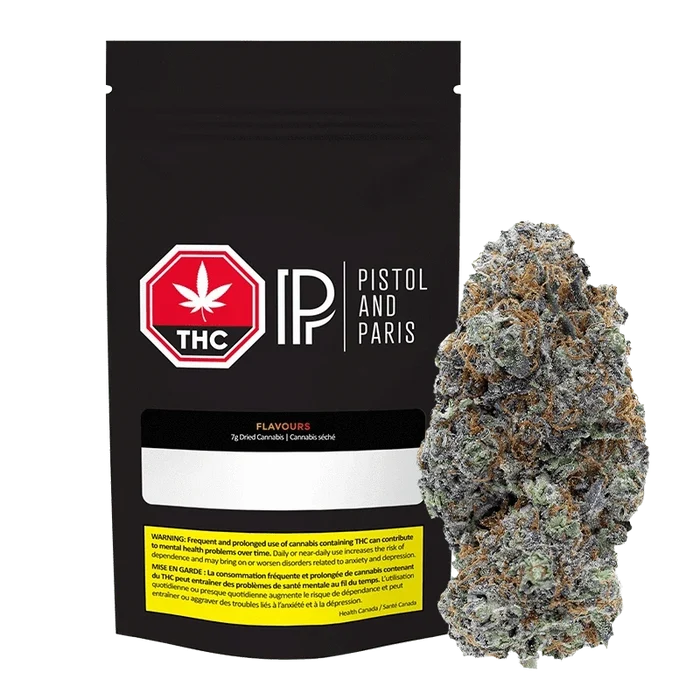 Front-facing black pouch and a dense frosted bud to its right, showing the 7 g Flavours Pistol and Paris packaging and cannabis.