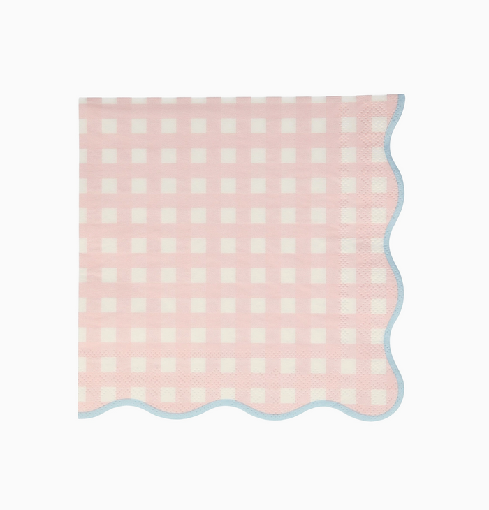 Pink and white checkered blanket on a light pink background