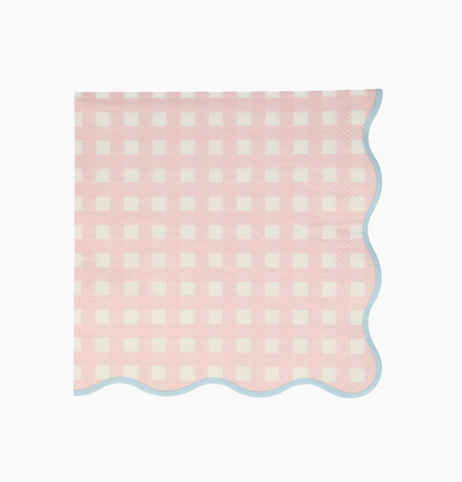 Pink and white checkered blanket on a light pink background