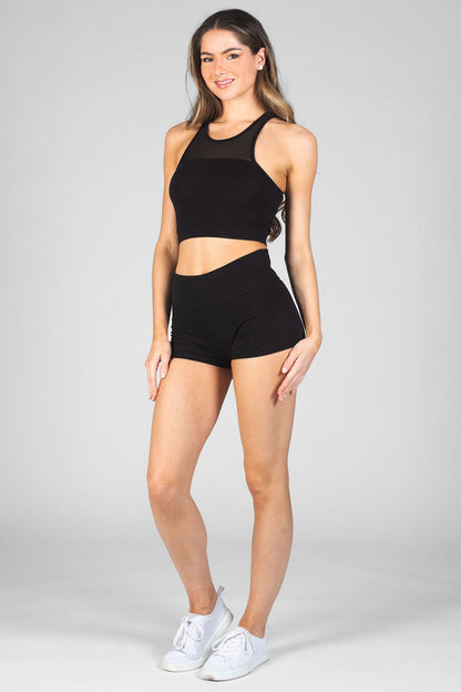 Woman wearing black High Band Hot Pants and black Monroe Crop vest Top