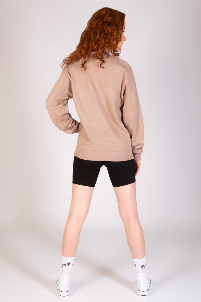 Women's black shorts with mocha coloured waistband and Pineapple badge logo.