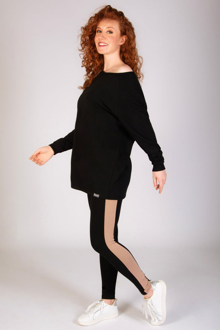 Black asymmetrical sweat top with off the shoulder feature designed by Debbie Moore for Pineapple Dance Studios