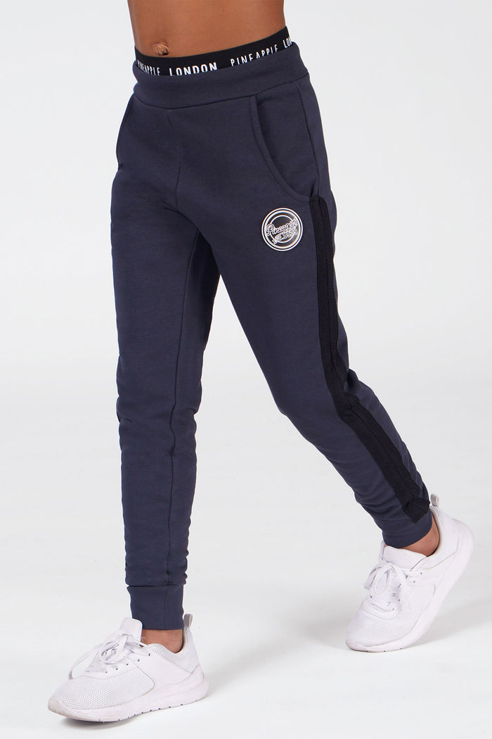Girl wearing Pineapple Charcoal Mesh Slim Trackpants