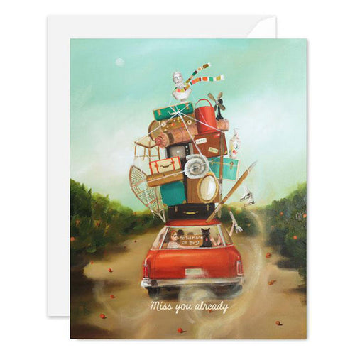 An illustration of a car packed with belongings and people, on a journey, featuring the Miss You Already Card at the bottom. This card showcases Janet Hill's unique artwork style.