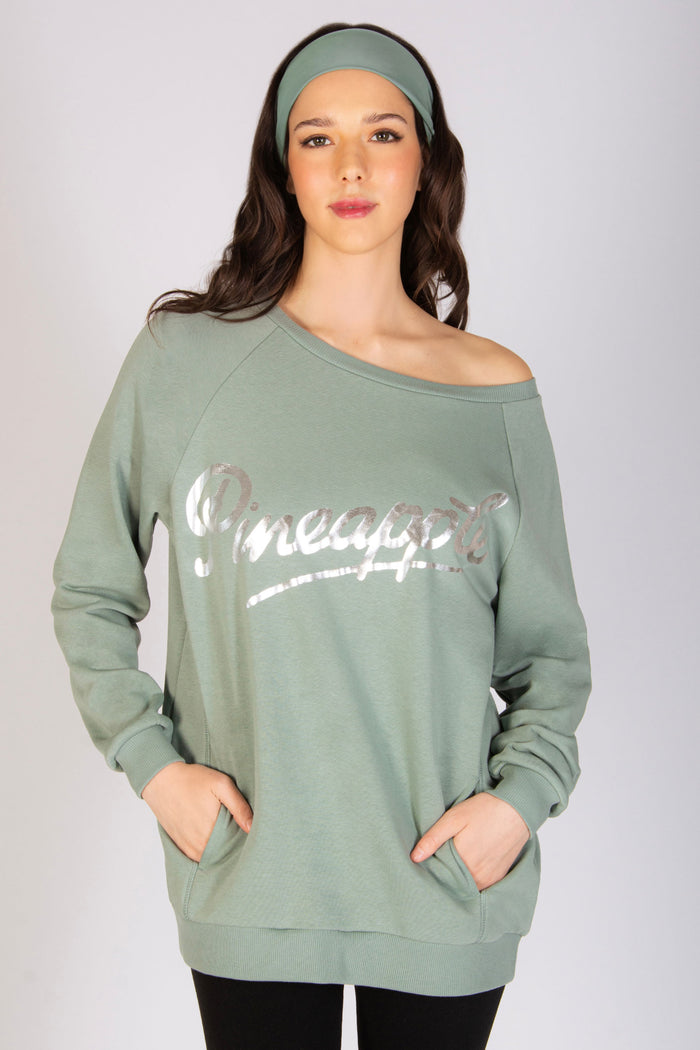 Martyna Balsam wearing sage off shoulder sweatshirts with matching headband