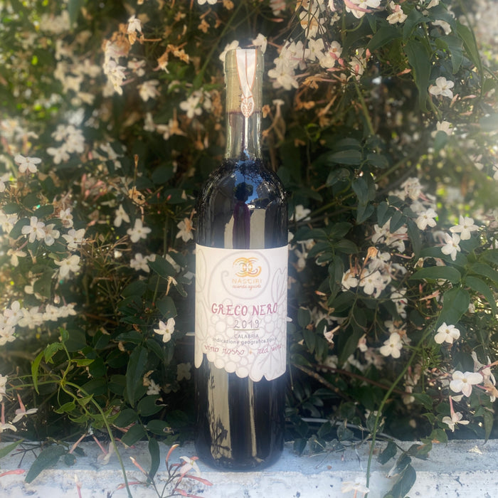 Nasciri Chillu Greco Nero 2019 wine bottle, dark glass with label and foil top