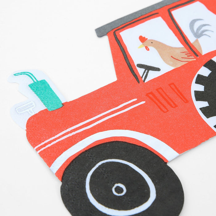 A close-up of a colorful paper napkin with a large red tractor and a rooster design.