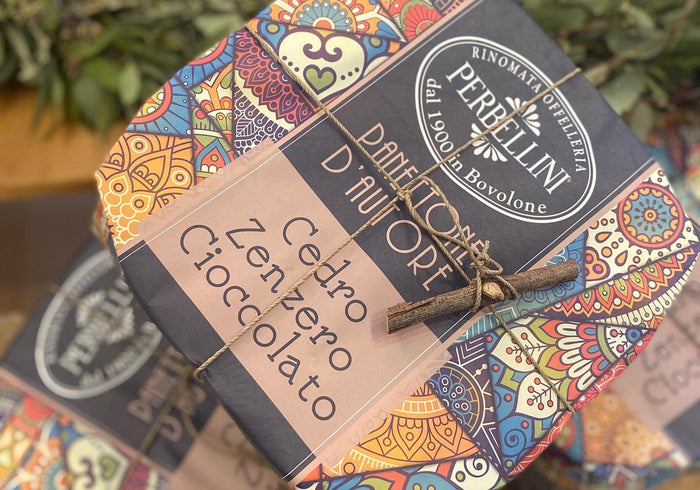 Panettone gift box with colorful patterned wrapping and flavor label