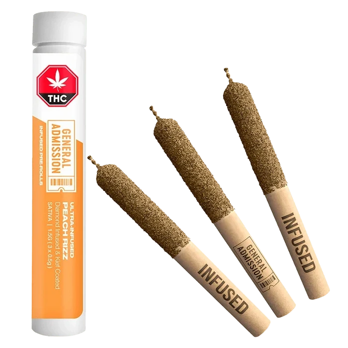 Diagonal view of three diamond-coated pre-rolls and a standing white-orange tube of Peach Rizz Diamond Infused PR 3 x 0.5 g.