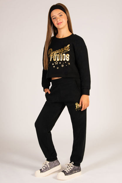 Festive teen outfit, perfect for lounging featuring black cuff goers with side pockets and matching jumper.
