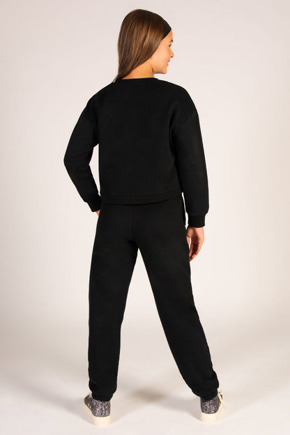 Black sweatpants for kids with two side pockets and an elasticated waistband.