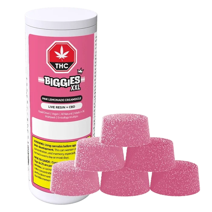 Front view of a pink-labeled Biggies XXL Pink Lemonade Creamsicle Live Resin THC:CBD Gummies 6 Pack container with six sugar-coated pink gummies stacked in front.