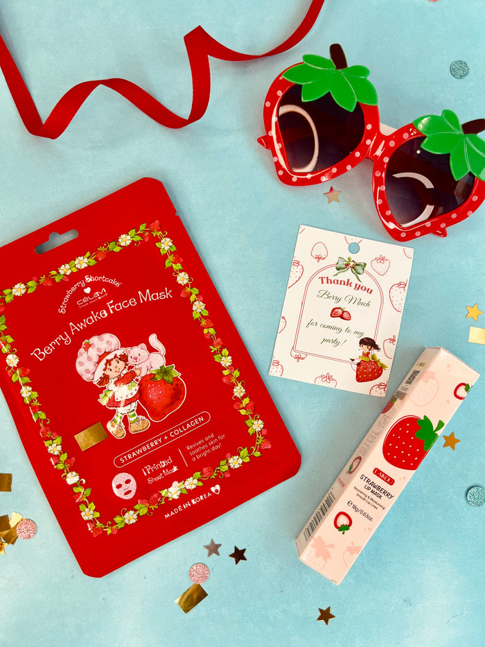 Berry-themed face mask packaging with strawberry design on a light blue background
