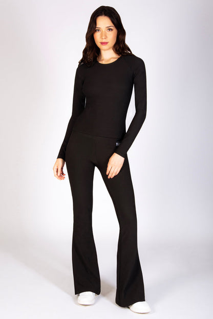 Women's black long sleeve rib top for the gym, available in all sizes, designed by Pineapple gymwear