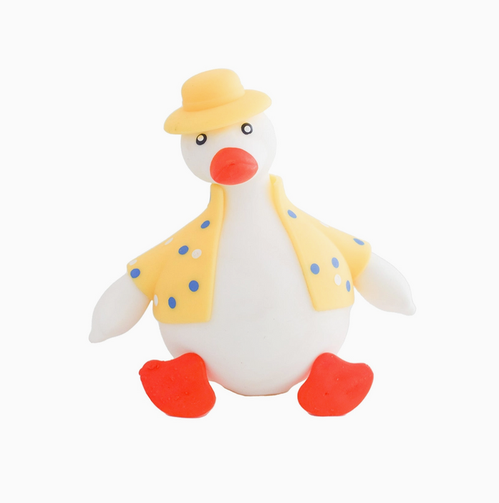 Toy duck with a yellow hat and vest on a white background