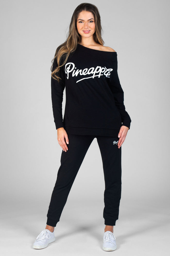 Woman wearing black Zip Skinny Joggers and black Monster Sweater