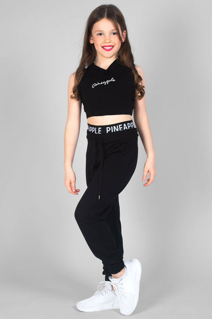 Girl wearing black Sleeveless Hoodie with white logo and black Double Trackpants