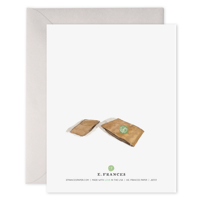 Illustrated greeting card featuring two anthropomorphized coffee cups hugging with the phrase "you're so hot," in gold-foiled writing is the E. Frances So Hot Card.