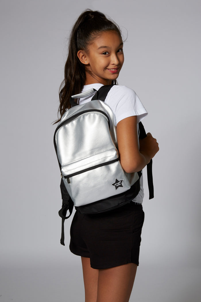 Girl carrying Pineapple Dance Silver Star Badge Backpack