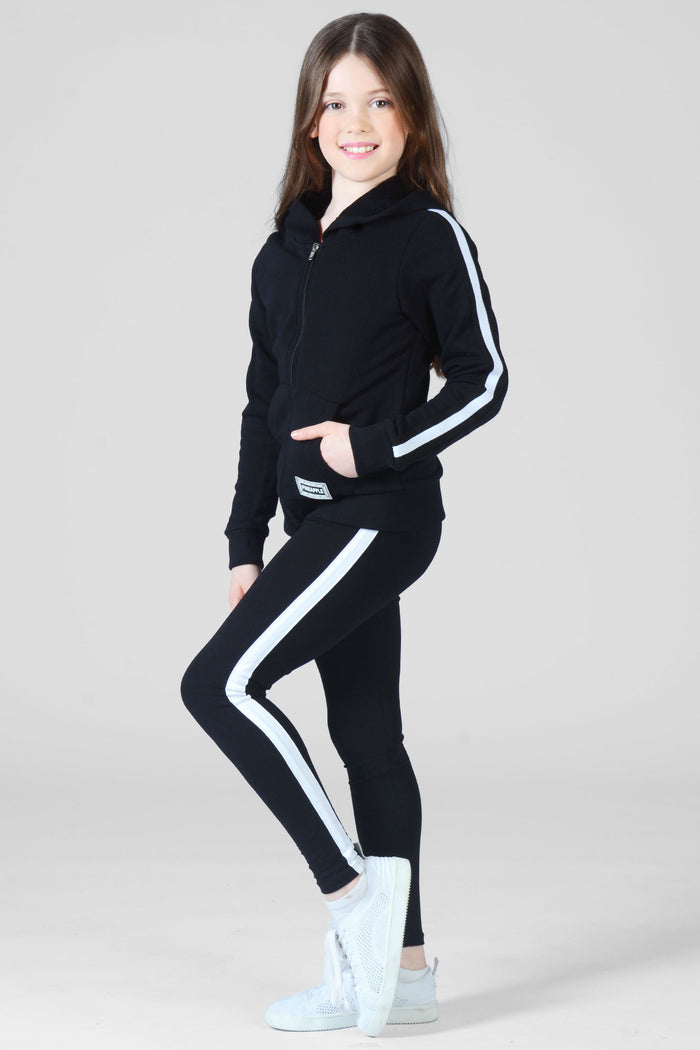 Girl wearing black full length Leggings and matching jacket with white stripe