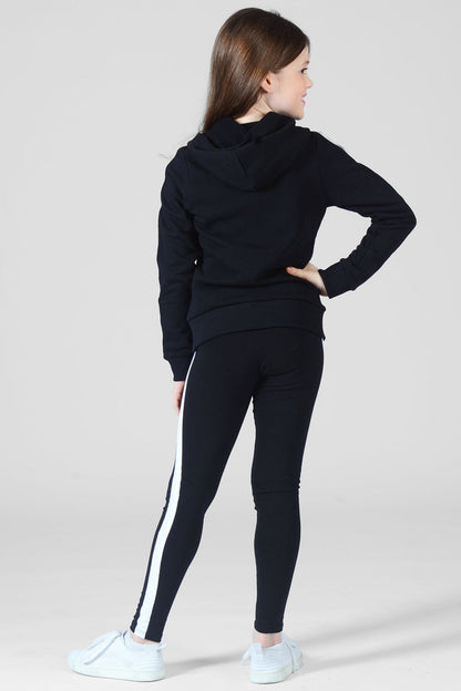 Girl wearing black full length Leggings with white stripe and matching jacket