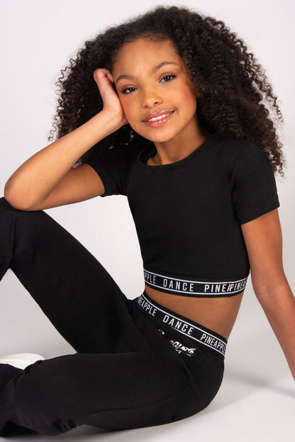 girls' black crop t-shirt with fitted tape hem.