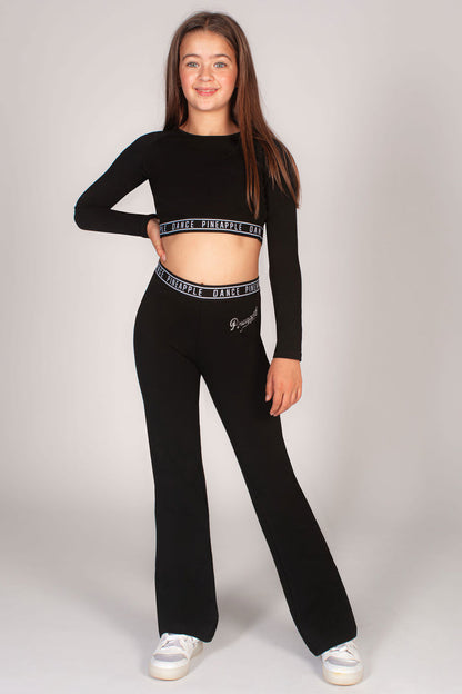Shop long sleeve crop top and matching flared jersey trousers for girls. The perfect matching dance outfit for kids.