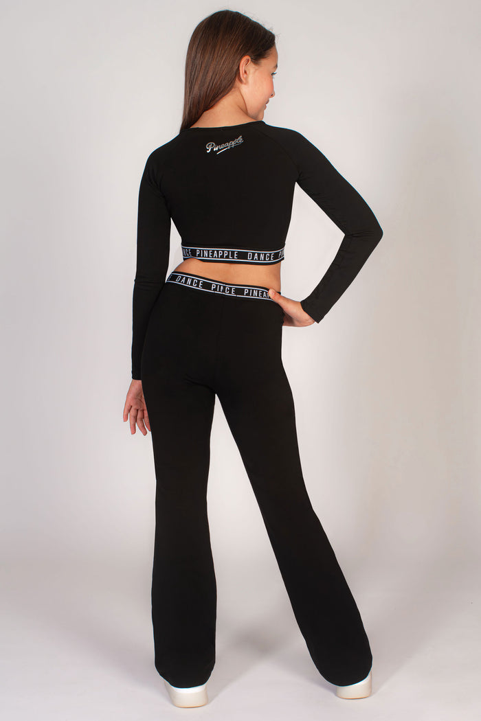 Black crop top with long fitted sleeves by Pineapple Dance Studios