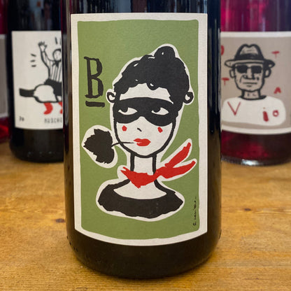 Wine bottle with green Bandita label and red hand graphic